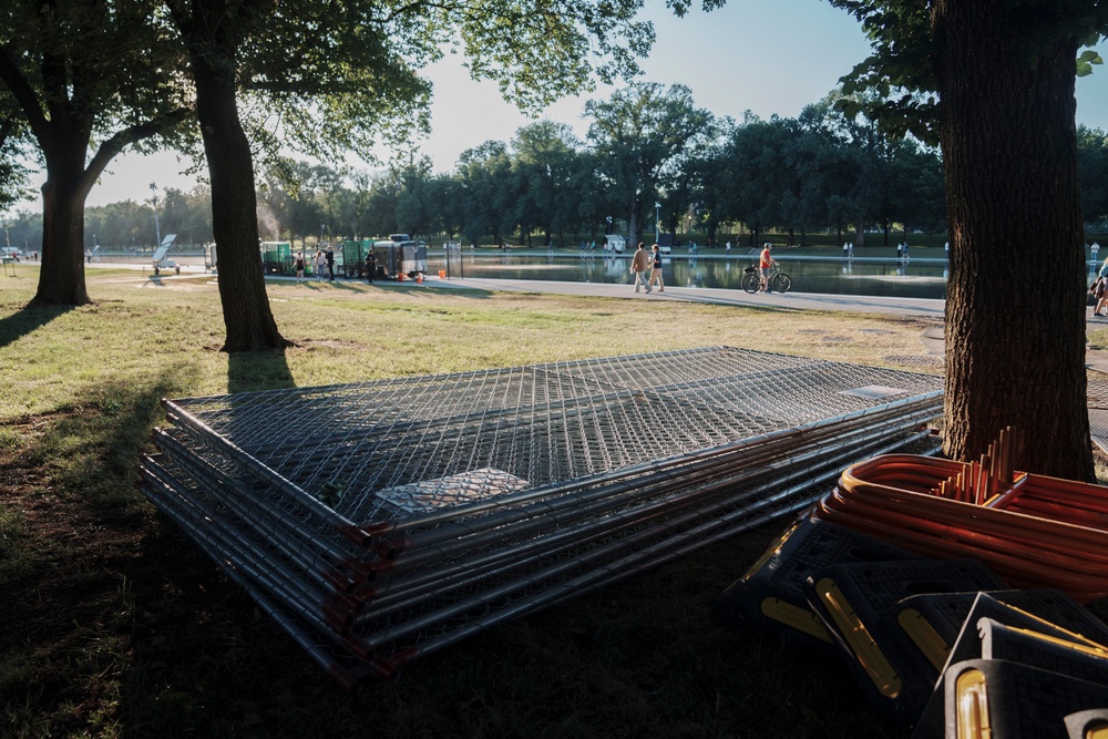 Fencing began going up around the Reflecting Pool on Tuesday (AP)