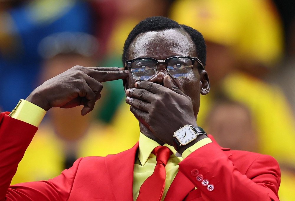 DR Congo fan Michel Nkuka Mboladinga poses before the match (Reuters)