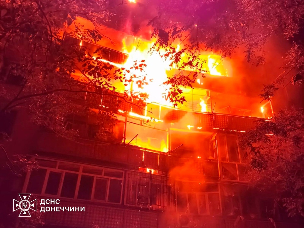In this photo provided by the Ukrainian Emergency Service, a fire rages in a multistory building after Russia's air attack on eastern Ukraine (Ukrainian Emergency Service)