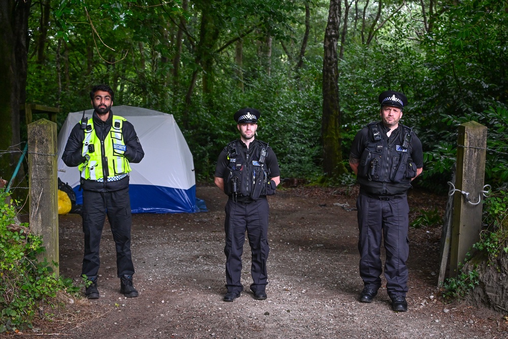 A manned police cordon in place at Paramoor Woods near the village of Sticker on July 26, 2025 in Truro (Getty)