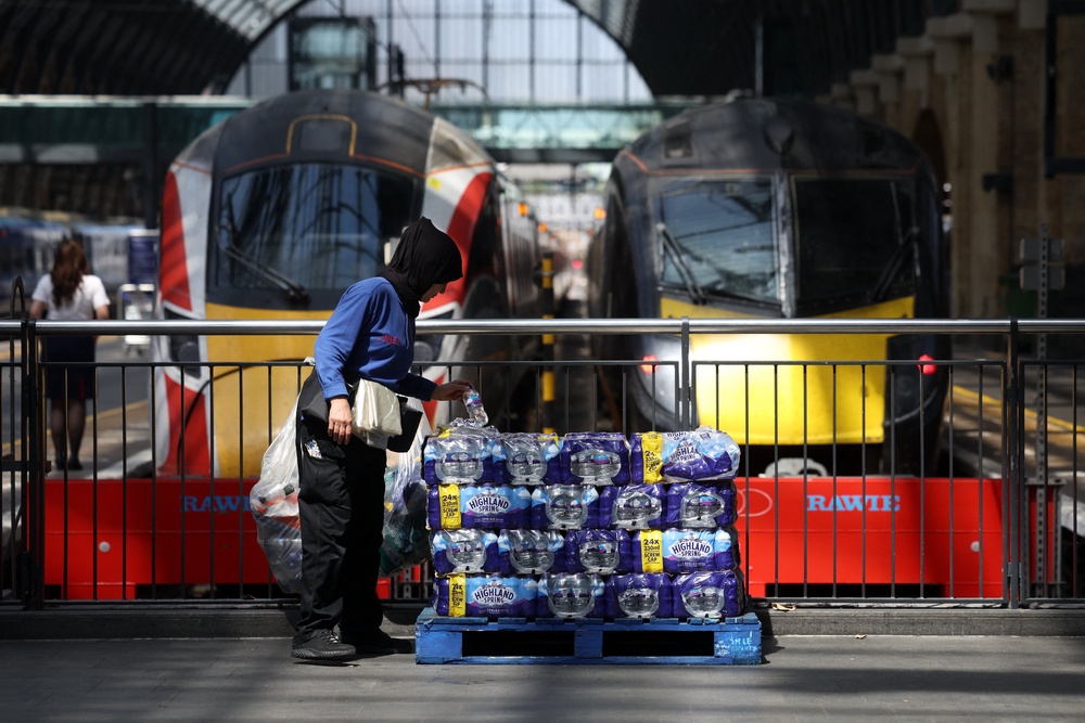 Stacks of water bottles are laid out for people to take at Kings Cross station in central London (AFP/Getty)