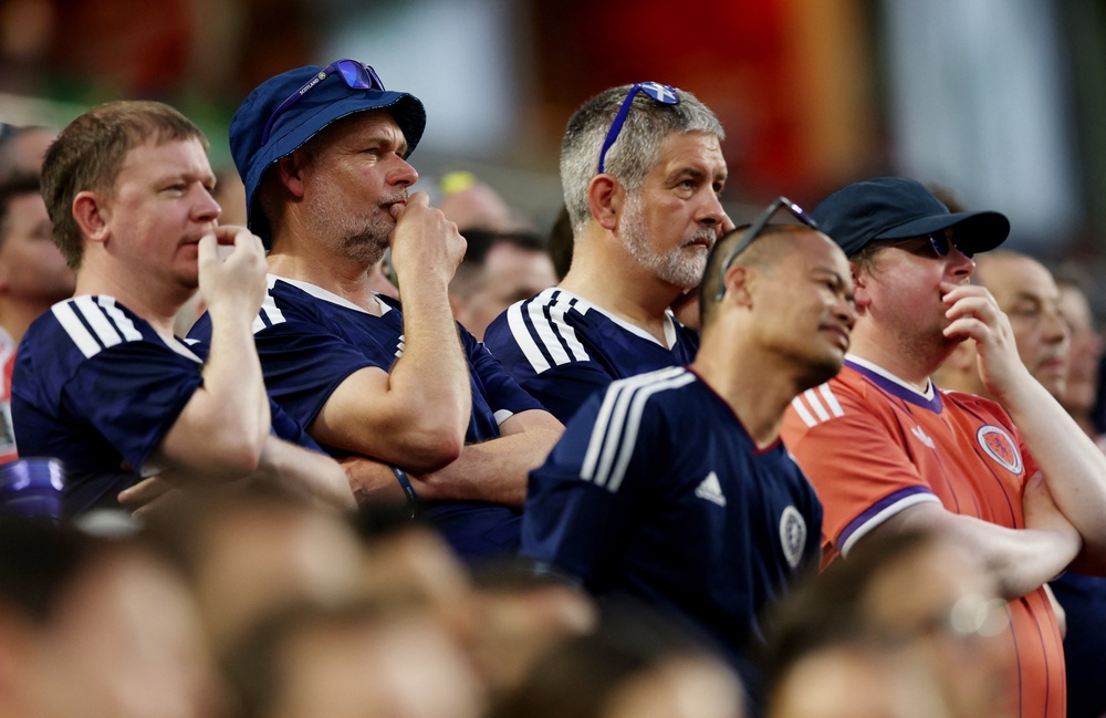 Scotland fans now face a nervous wait to see if their side will qualify for the knockout rounds (Reuters)