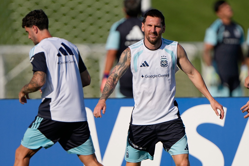 Argentina's Lionel Messi, right, trains with teammates for the World Cup soccer tournament (AP)