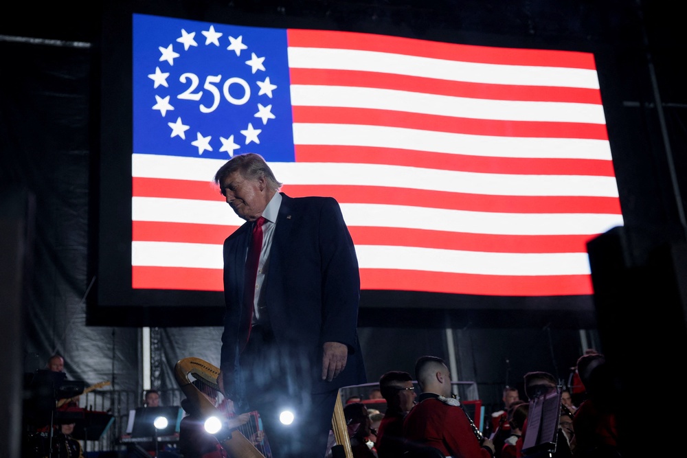 US president Donald Trump walks off stage after speaking at a rally to kick off the Great American State Fair in celebration of the 250th anniversary of US independence (Reuters)