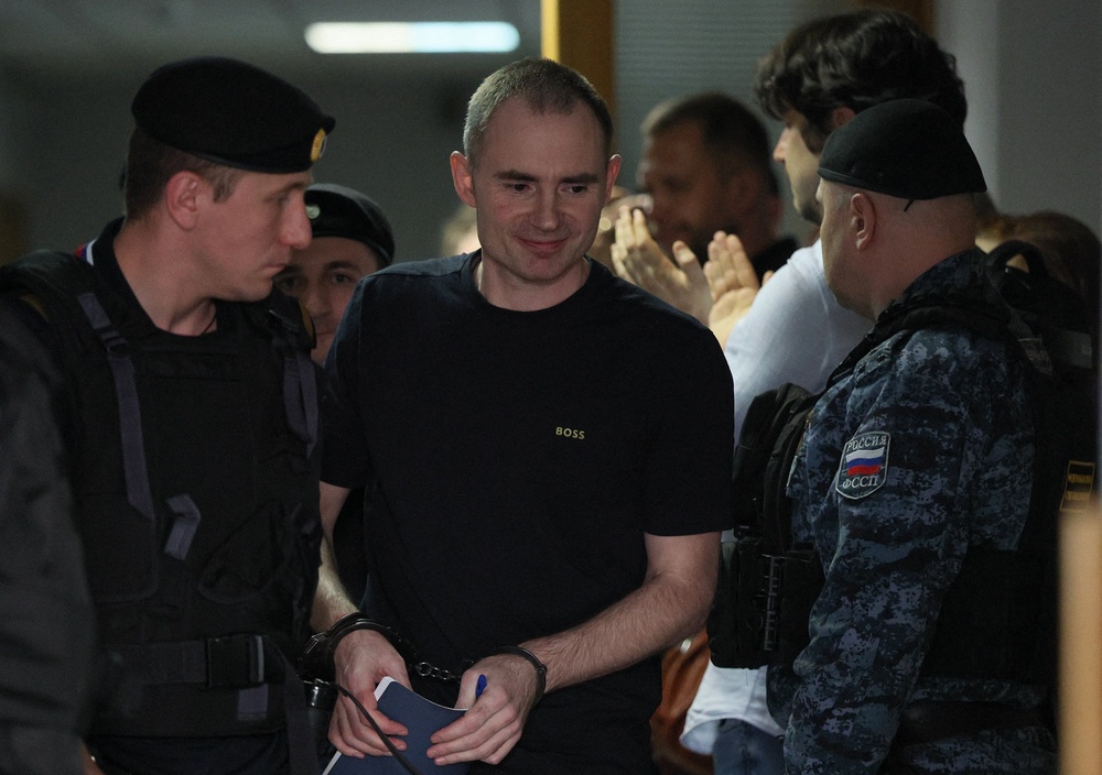 Russian opposition politician and deputy leader of the liberal Yabloko party, Maxim Kruglov, who was convicted of deliberately spreading false information about the Russian army during the conflict against Ukraine and jailed for seven years, leaves a courtroom after a hearing in Moscow (Reuters)