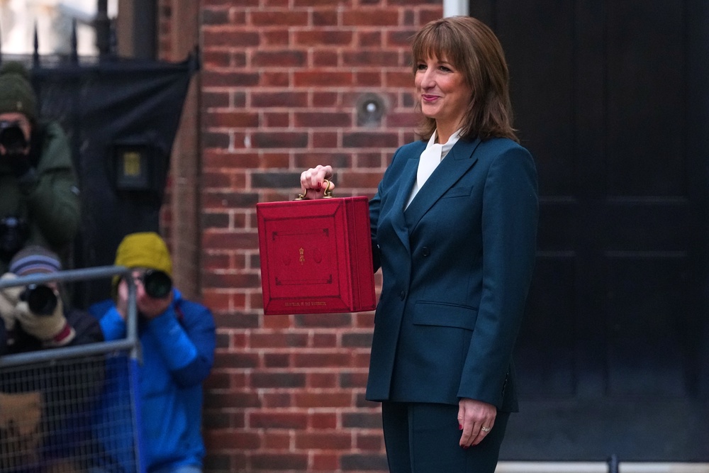 Chancellor Rachel Reeves poses outside 11 Downing Street, London, with her ministerial red box, before delivering her Budget (Frank Augstein/PA) (PA Archive)