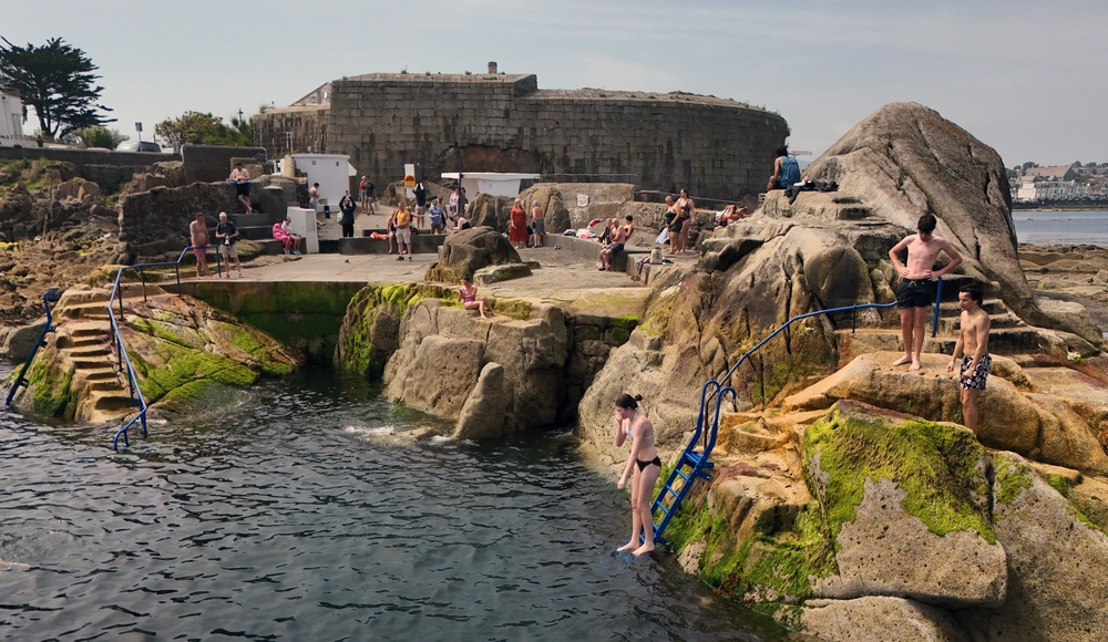 People cooling off at the Forty Foot bathing place at Sandycove (Niall Carson/PA) (PA Wire)