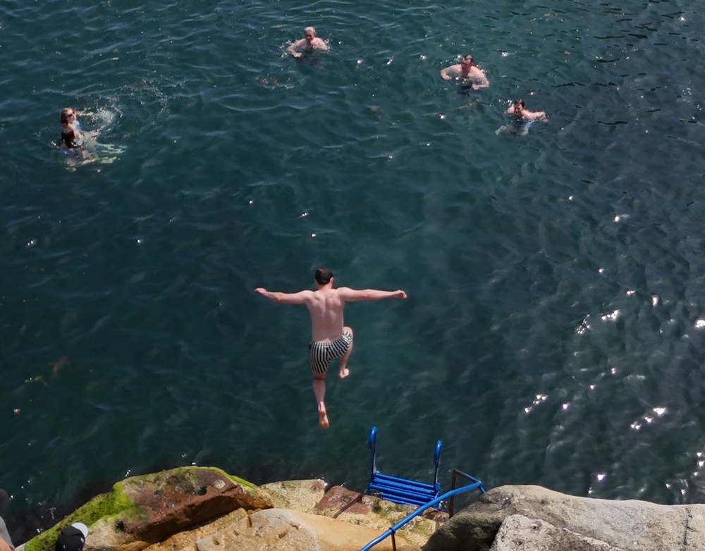 People cooling off at the Forty Foot bathing place at Sandycove (Niall Carson/PA) (PA Wire)