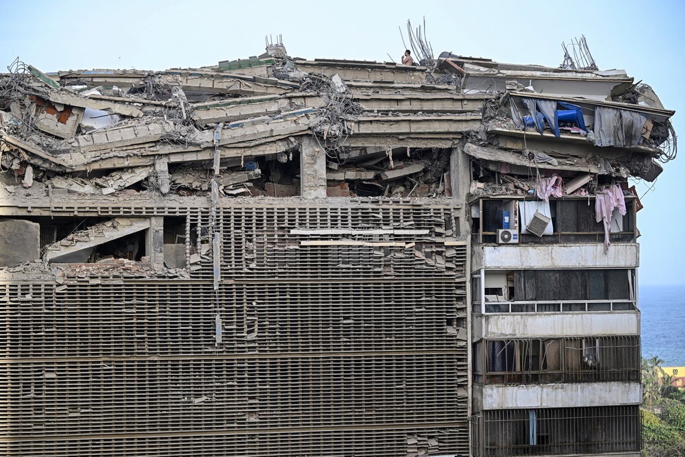 A damaged building some 30km north-west of Caracas, after a twin earthquake that was Venezuela's largest in over a century has killed at least 164 people (AFP/Getty)