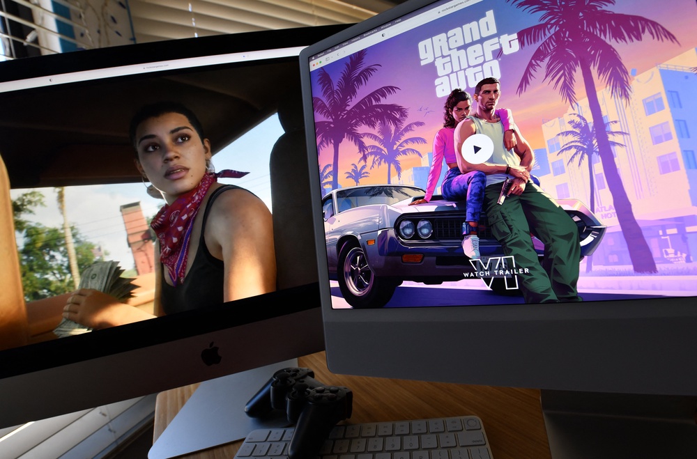 Rockstar Games' Grand Theft Auto 6 trailer shown on computer screens in Los Angeles, California, on 5 December 2023 (AFP/Getty)