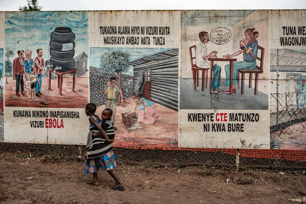 Children walk by posters warning people about Ebola on 24 June 2026, in Goma, Democratic Republic of Congo (Getty)