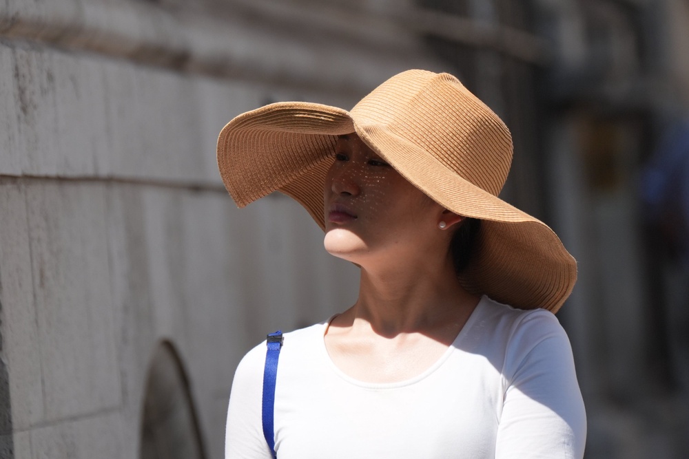 A woman wearing a hat outside Blackfriars station in London (Yui Mok/PA) (PA Wire)