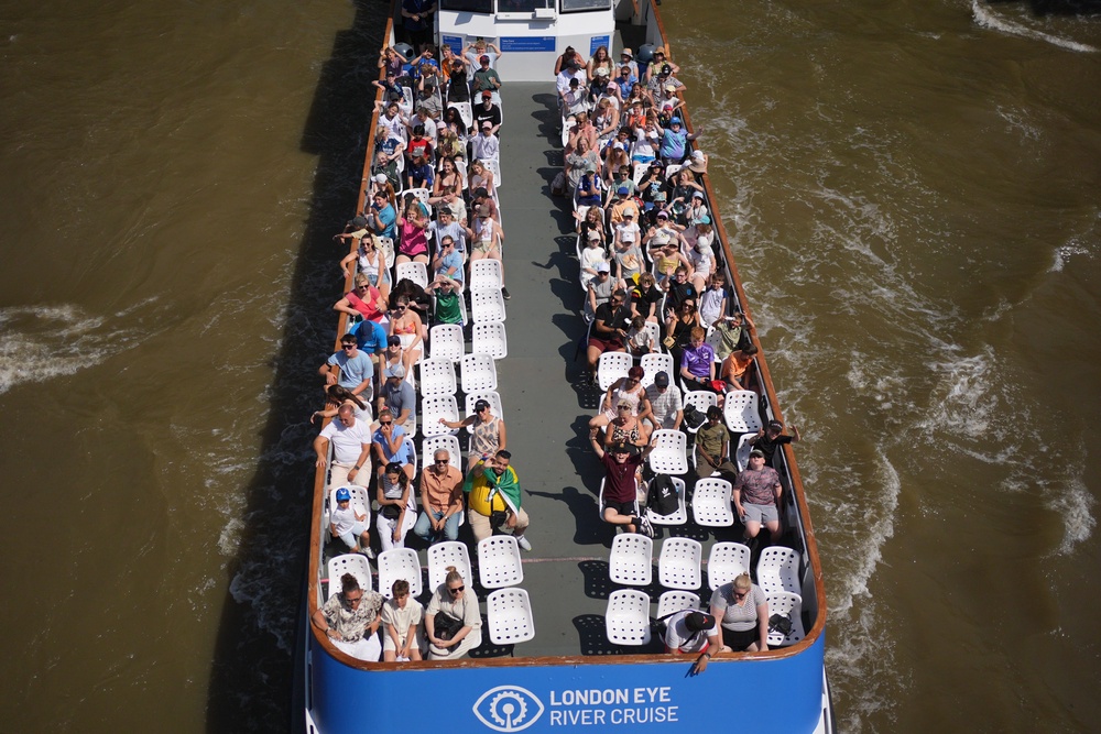 People on a river cruise on the River Thames in London (Yui Mok/PA) (PA Wire)