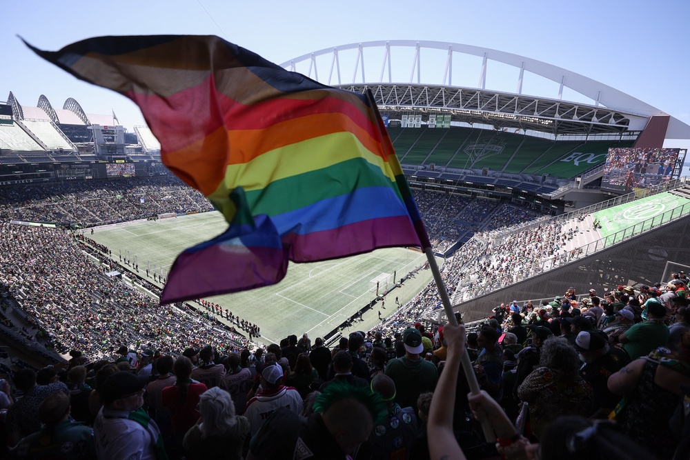 A fan waves a Pride flag before the game between the Seattle Sounders and the Portland Timbers at Lumen Field on June 03, 2023 (Getty Images)