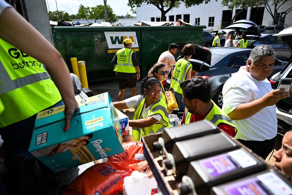 In Florida, workers for the Doral-based aid group Global Empowerment Mission on Thursday packed medical supplies, toiletries, cases of bottled water and nonperishable foods to be sent to Venezuela (Chandan Khanna / AFP via Getty Images)