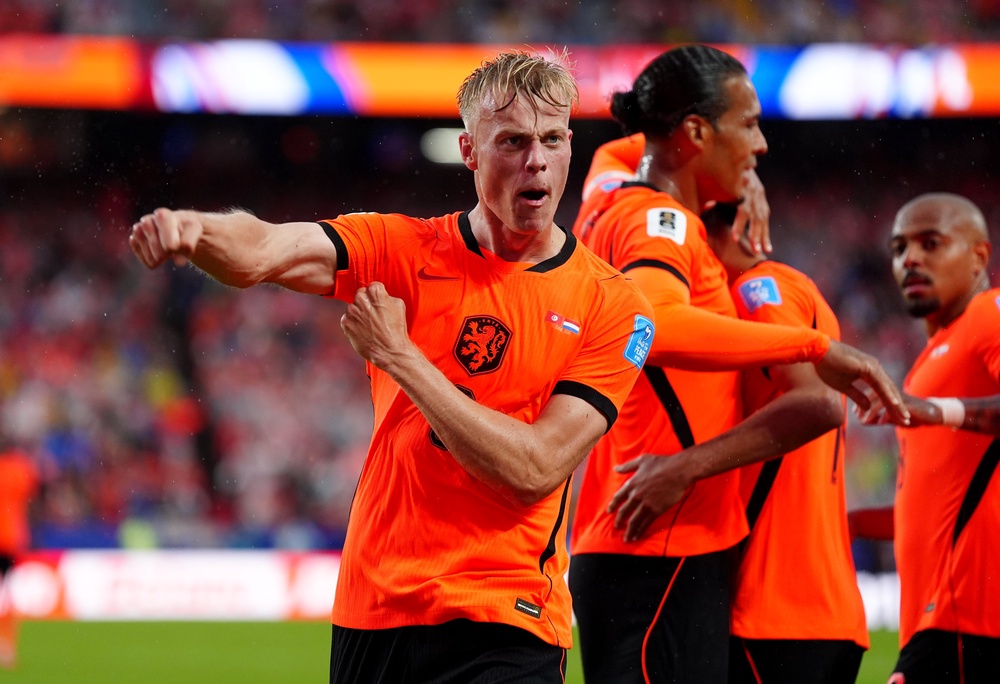 Netherland's Jan Paul van Hecke celebrates scoring their sides third goal (PA)