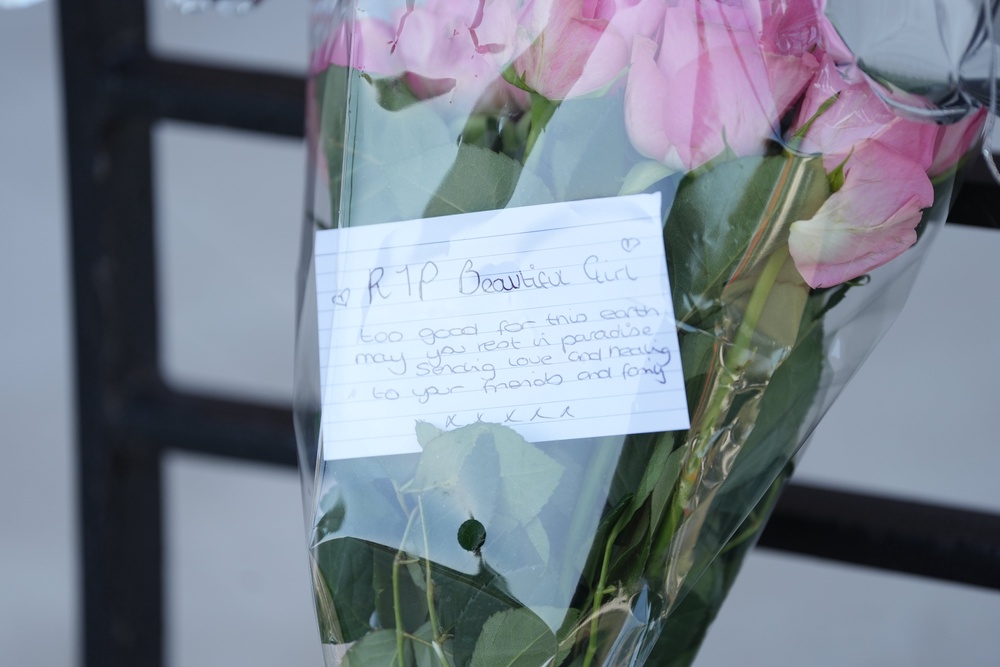 Eight bouquets of flowers have been left at the entrance to Syward Place, a flat complex on the corner of Pycroft Road and Bell Bridge Road (PA)