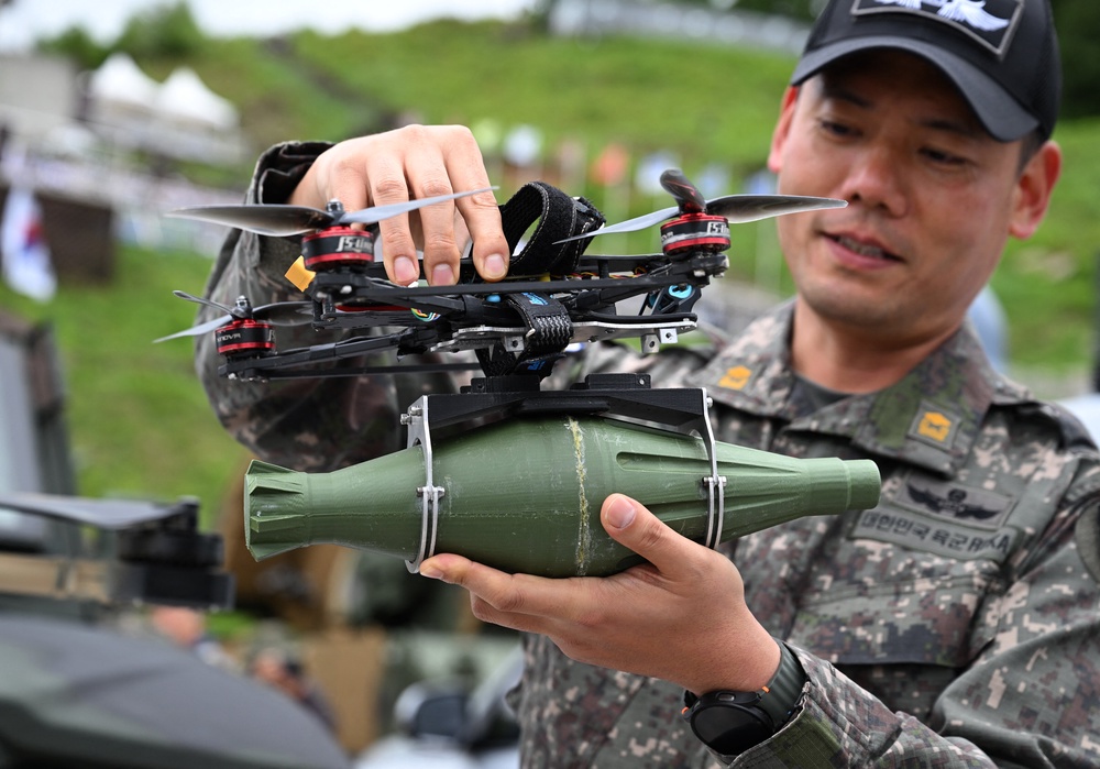 A South Korean soldier holds a tactical drone with a mock bomb (AFP via Getty)