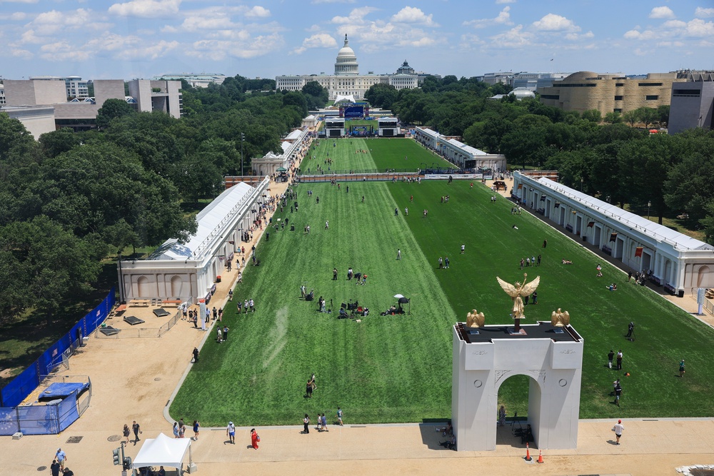 Visitors were seen observing a rodeo, riding a Ferris wheel and sitting in the shade provided by a model of Trump’s triumphal arch (Getty Images)