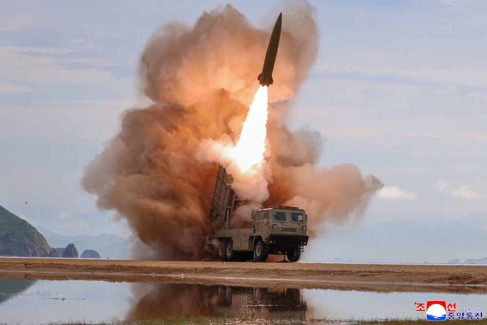 A rocket launcher fires a munition during the weapons test (Reuters)