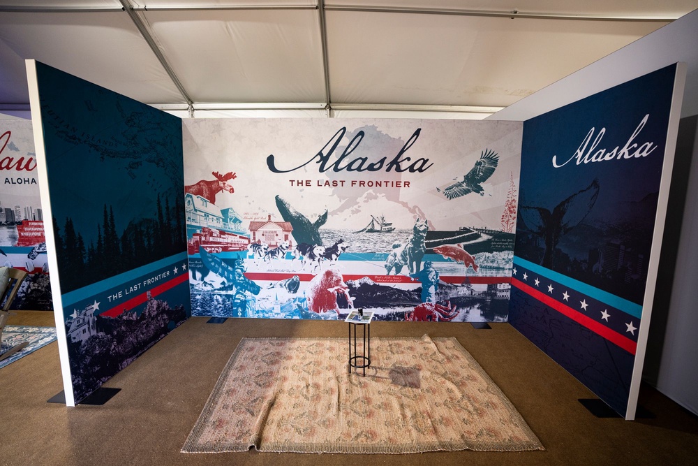 Alaska’s booth was extremely pared down, only containing a rug and a tiny table, photos show (Getty Images)