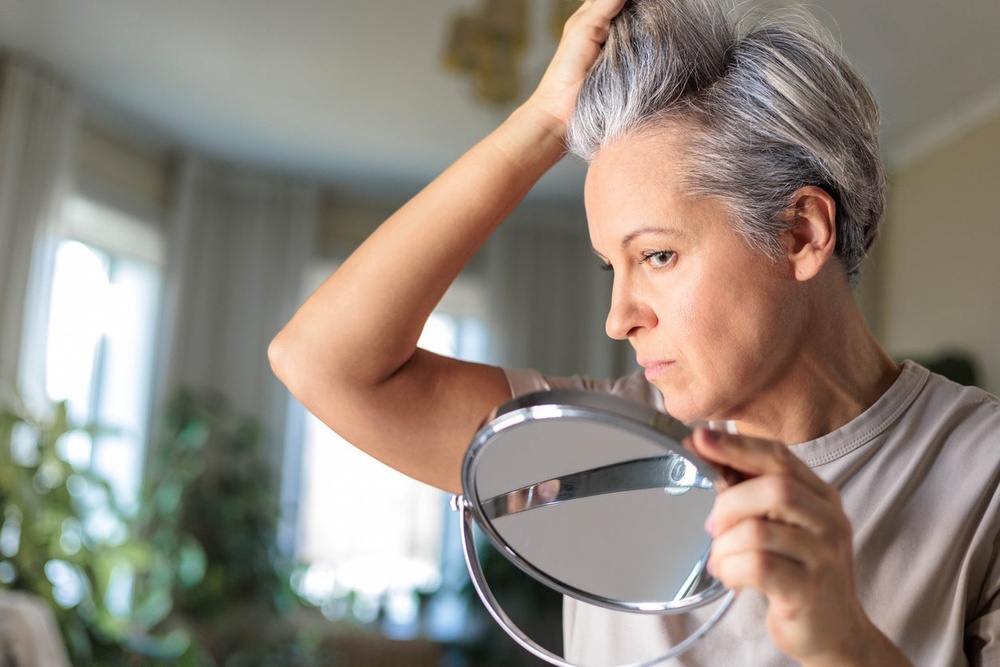 Grey hair is more porous and “more exposed” to external factors. (Getty Images)