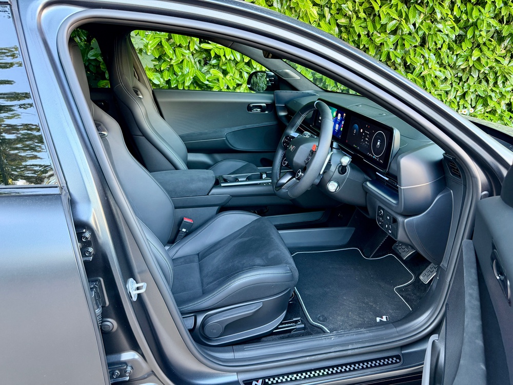 Grippy sports front seats hold you well in corners, and are comfy on longer drives, too (Steve Fowler)