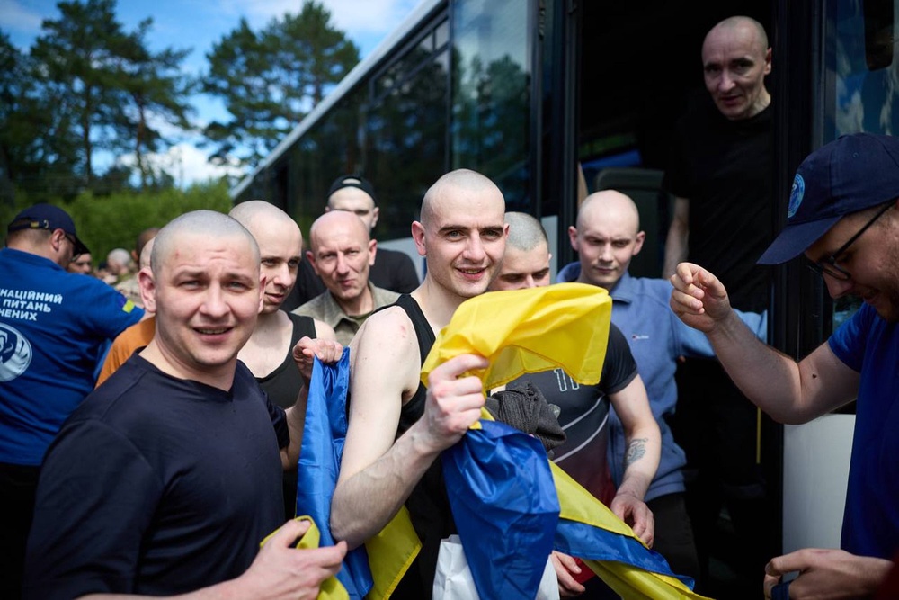 Ukrainian prisoners of war react after a prisoner exchange at an undisclosed location, Ukraine, Friday (AP)