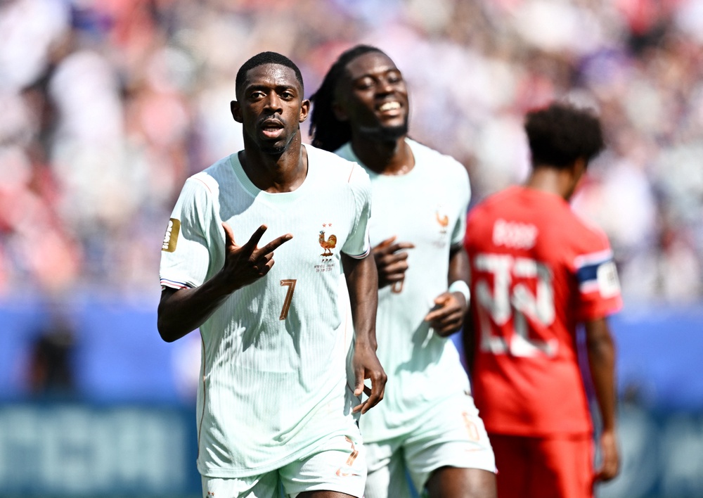 France's Ousmane Dembele celebrates scoring their third goal (Reuters)