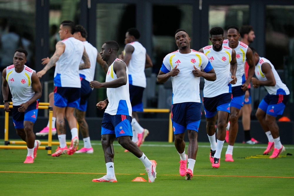 Colombia players during training wear pink boots (AP)