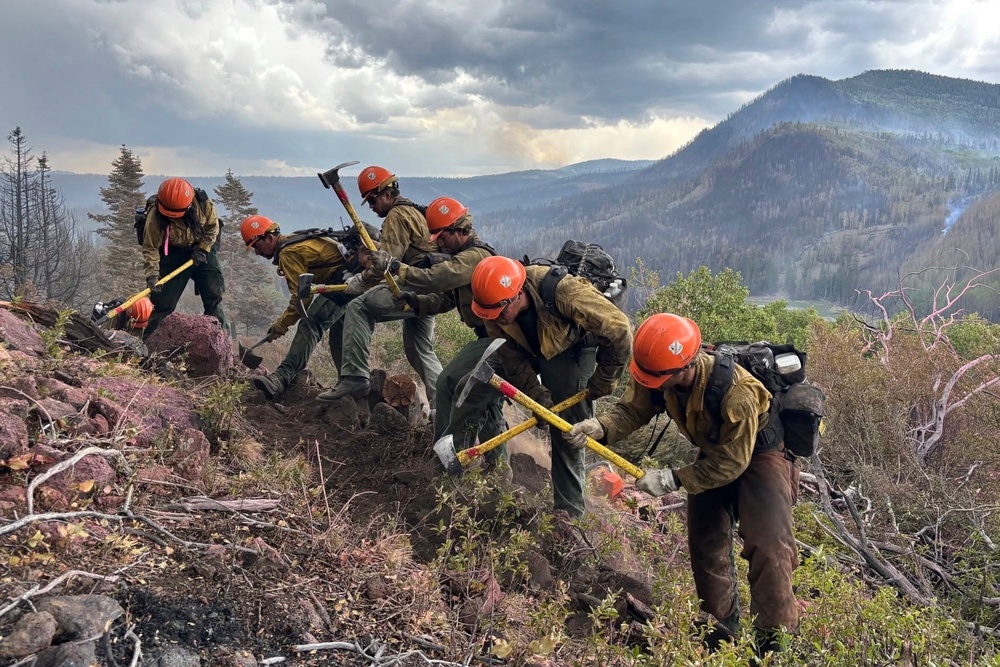 This undated image provided by the U.S. Forest Service Friday, June 26, 2026, shows firefighters responding to the Cottonwood Fire on Wednesday, June 24, 2026, above Birch Lake, near Beaver, Utah. (Mike McMillan/U.S. Forest Service via AP) (AP)