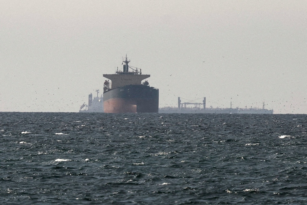 Cargo ships in the Gulf, near the Strait of Hormuz (Reuters)