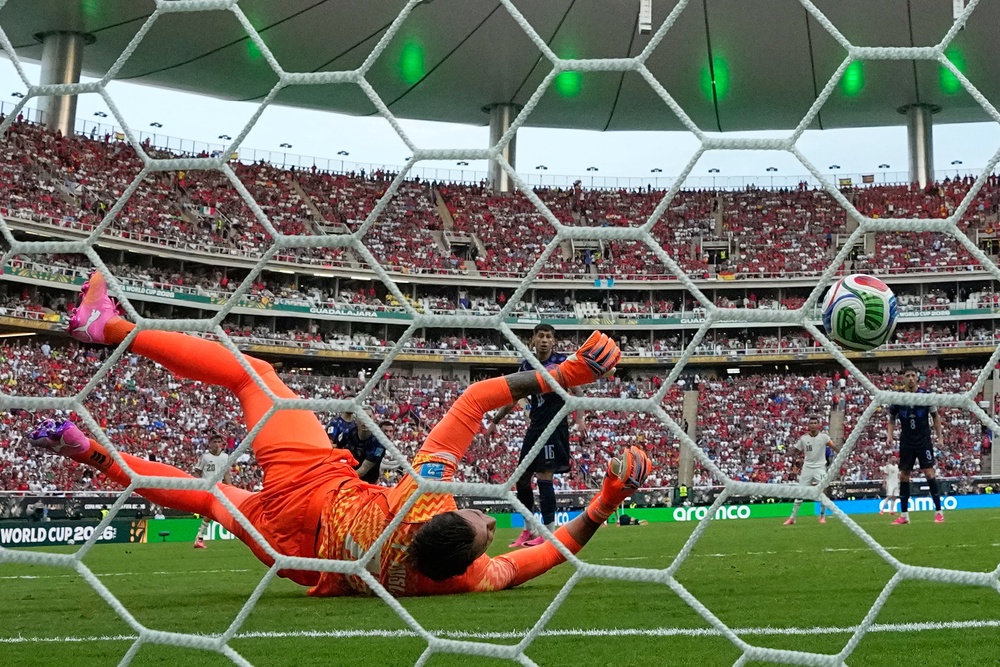 Fernando Muslera bundles the ball into his own net (AP)