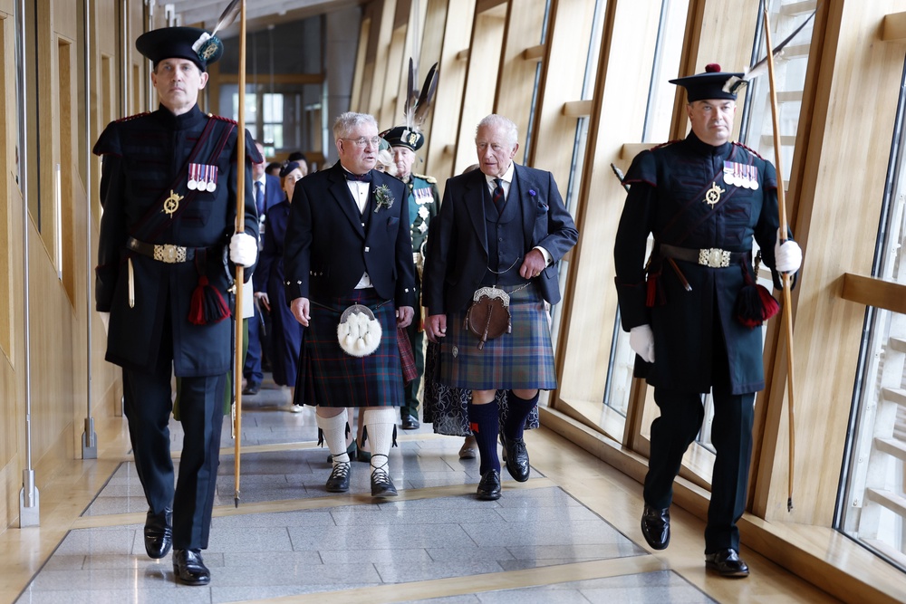 Charles is escorted by Presiding Officer Kenneth Gibson MSP as they arrive for the opening of the seventh session of the Scottish Parliament in Edinburgh (Jeff Mitchell/PA) (PA Wire)