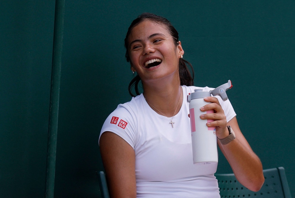 Raducanu was seen laughing with her team but she wore strapping around her right ankle (Reuters)