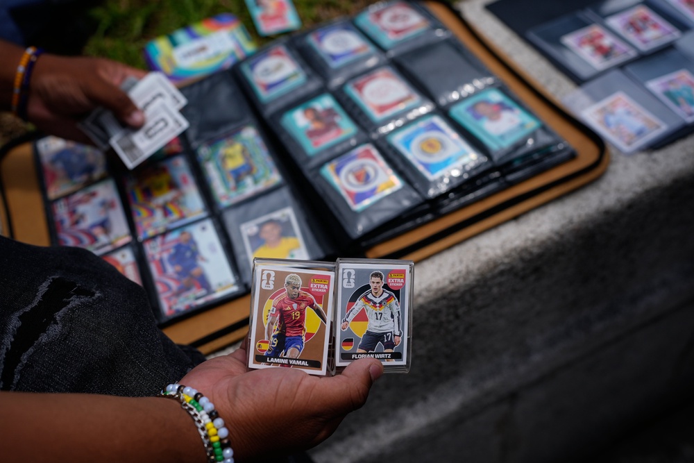 Youth exchange Panini World Cup stickers in Mexico City, Tuesday, June 16, 2026. (AP Photo/Marco Ugarte) (AP)