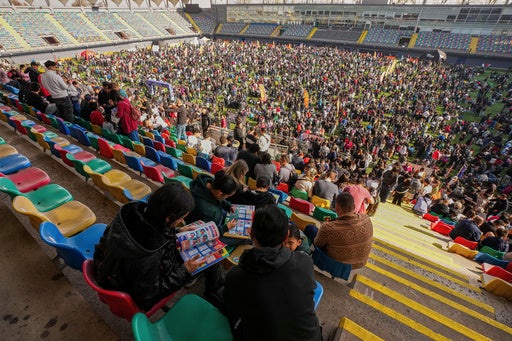 Soccer fans gather to trade Panini World Cup sticker albums and trading cards at the Bicentenario de La Florida stadium in Santiago, Chile, Sunday, May 31, 2026. (AP)