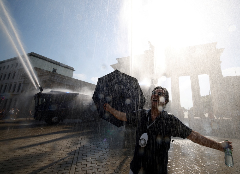 A man in Berlin as the deadly heatwave moves east to mainland Europe (Reuters)