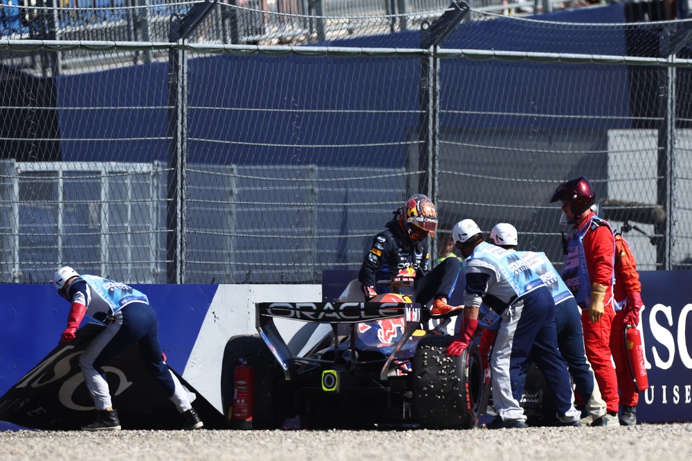 Verstappen’s accident brought out the yellow flags in the final seconds, and with Charles Leclerc leading the way, his Ferrari mechanics celebrated their man taking pole (Getty)