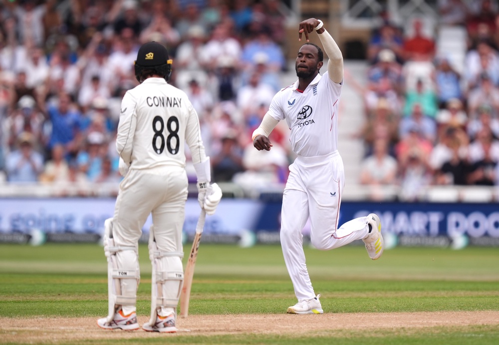 England’s Jofra Archer (right) celebrates the wicket of Devon Conway (Mike Egerton/PA)