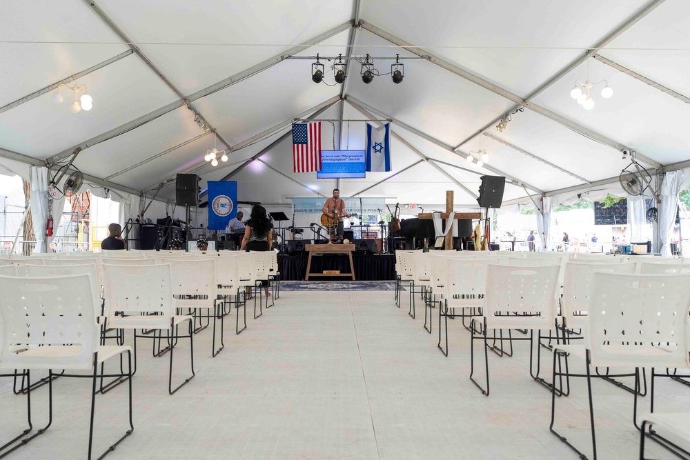 Jason Hershey, founder of David’s Tent, performs for what appears to be just two people Saturday at the Great American State Fair worship space (AP)