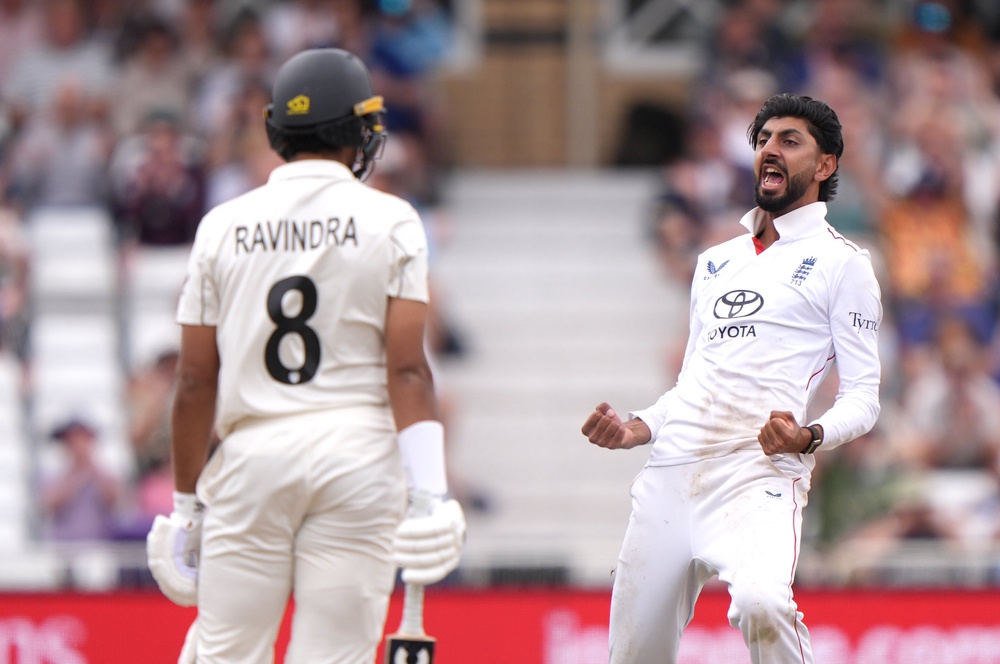 Shoaib Bashir celebrates taking the dismissal of Rachin Ravindra (Joe Giddens/PA) (PA Wire)