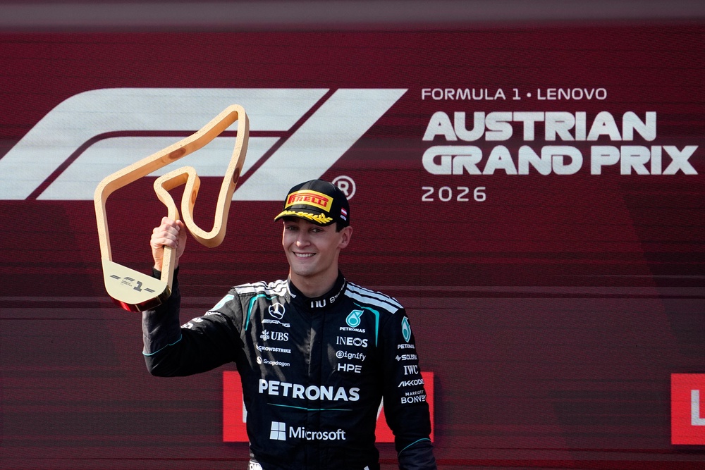 George Russell poses with the trophy (Darko Bandic/AP) (AP)