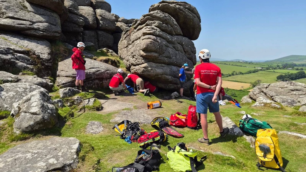 Rescuers working to free a schoolgirl trapped on Hound Tor, Dartmoor, Devon (Devon Cave Rescue Organisation)