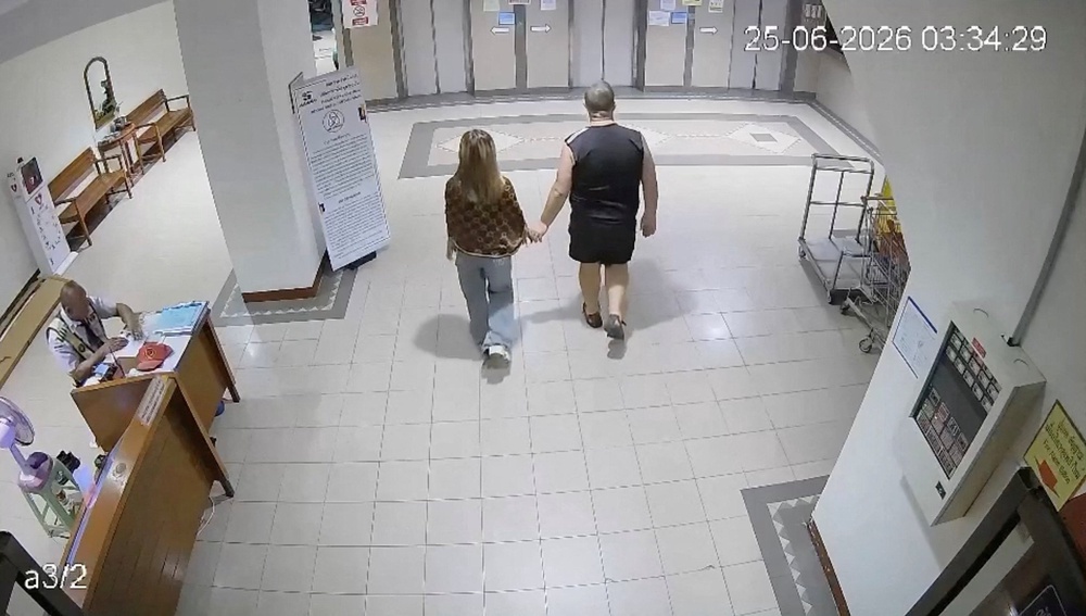 Police say CCTV footage shows Simon Peter Carman entering an apartment block with the 17-year-old Thai girl, whose body was found in a suitcase in Pattaya City (Pattaya Provincial Police Station)