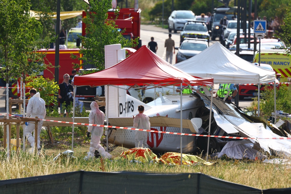 Forensic technicians examine a skydiving plane that crashed in Tomblaine northeastern France, killing all 11 people on board, Sunday, June 28, 2026. (AP Photo/Antonin Utz) (AP)