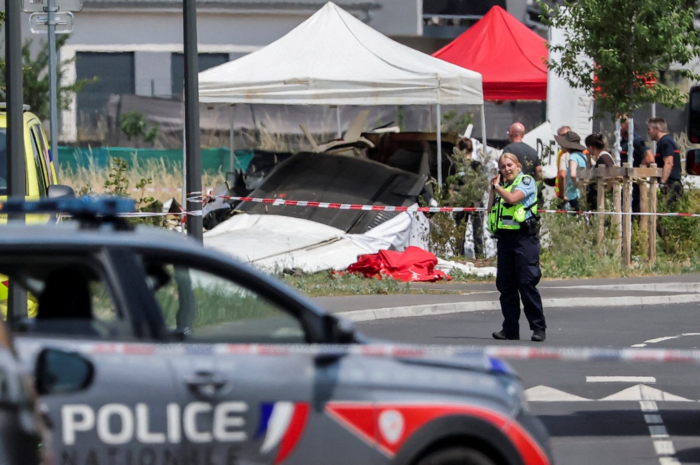 A rescuer works at the site of a plane crash in Tomblaine, France (Reuters)