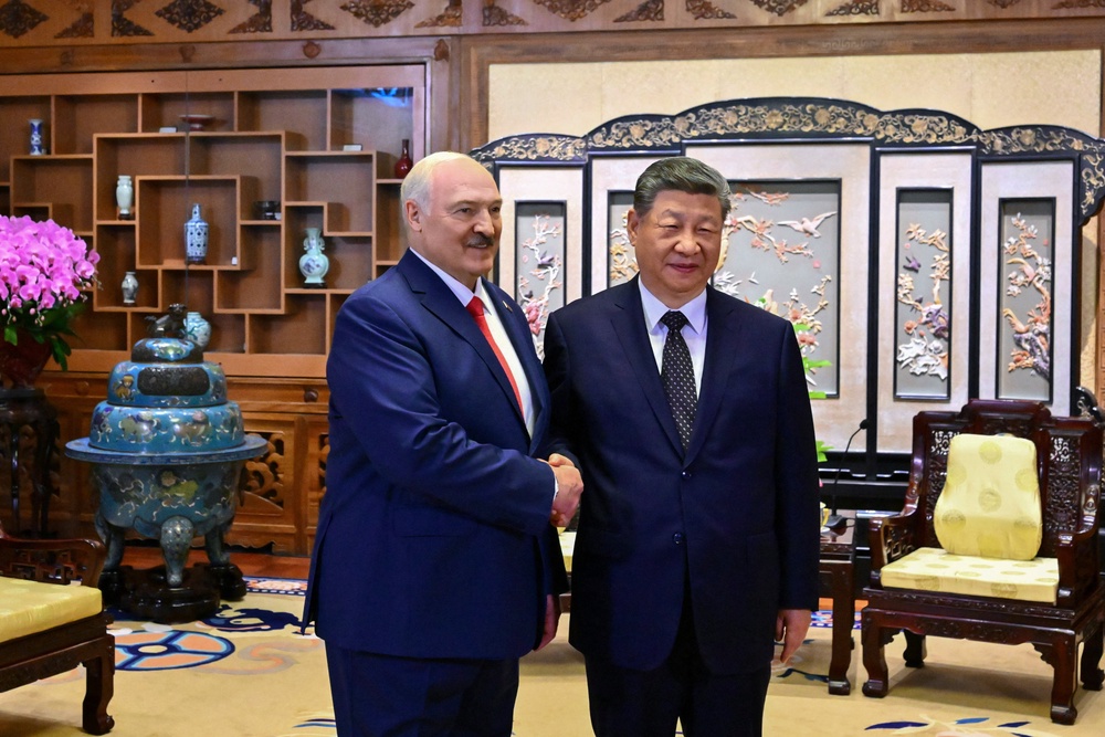 Belarusian president Alexander Lukashenko shakes hands with Chinese president Xi Jinping during a meeting in Beijing (Reuters)