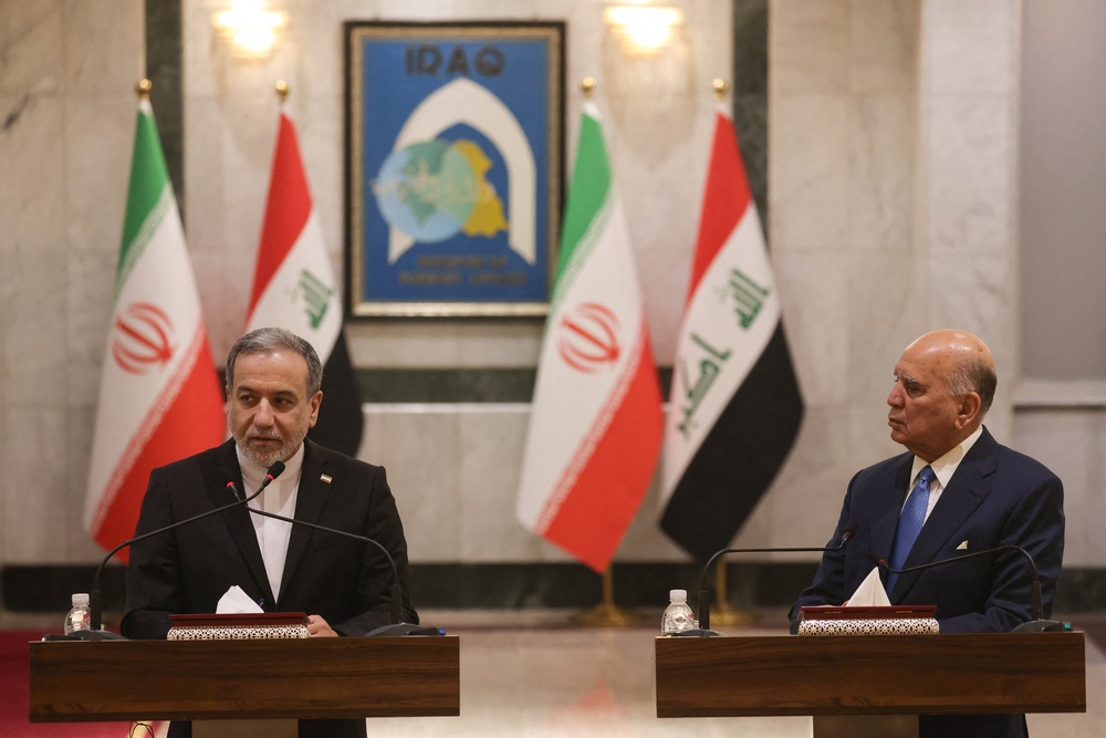 Iranian Foreign Minister Abbas Araghchi and Iraqi Foreign Minister Fuad Hussein hold a joint press conference following a meeting in Baghdad (AFP/Getty)