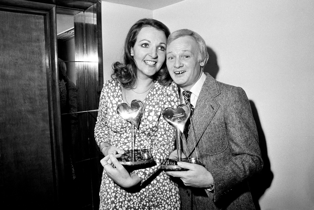 Penelope Keith was named Show Business Personality of 1976 by the Variety Club of Great Britain, with Are You Being Served star John Inman, who was named joint BBC TV Personality that year (PA) (PA Archive)